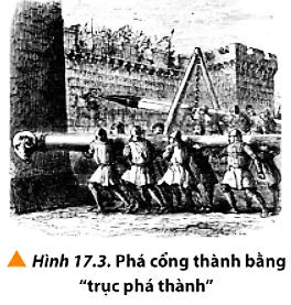 Hãy tìm hiểu về “trục phá thành” dùng để phá cổng thành trong các cuộc chiến thời xưa (Hình 17.3). Giải thích tại sao “trục phá thành” phải có khối lượng đủ lớn. (ảnh 1)